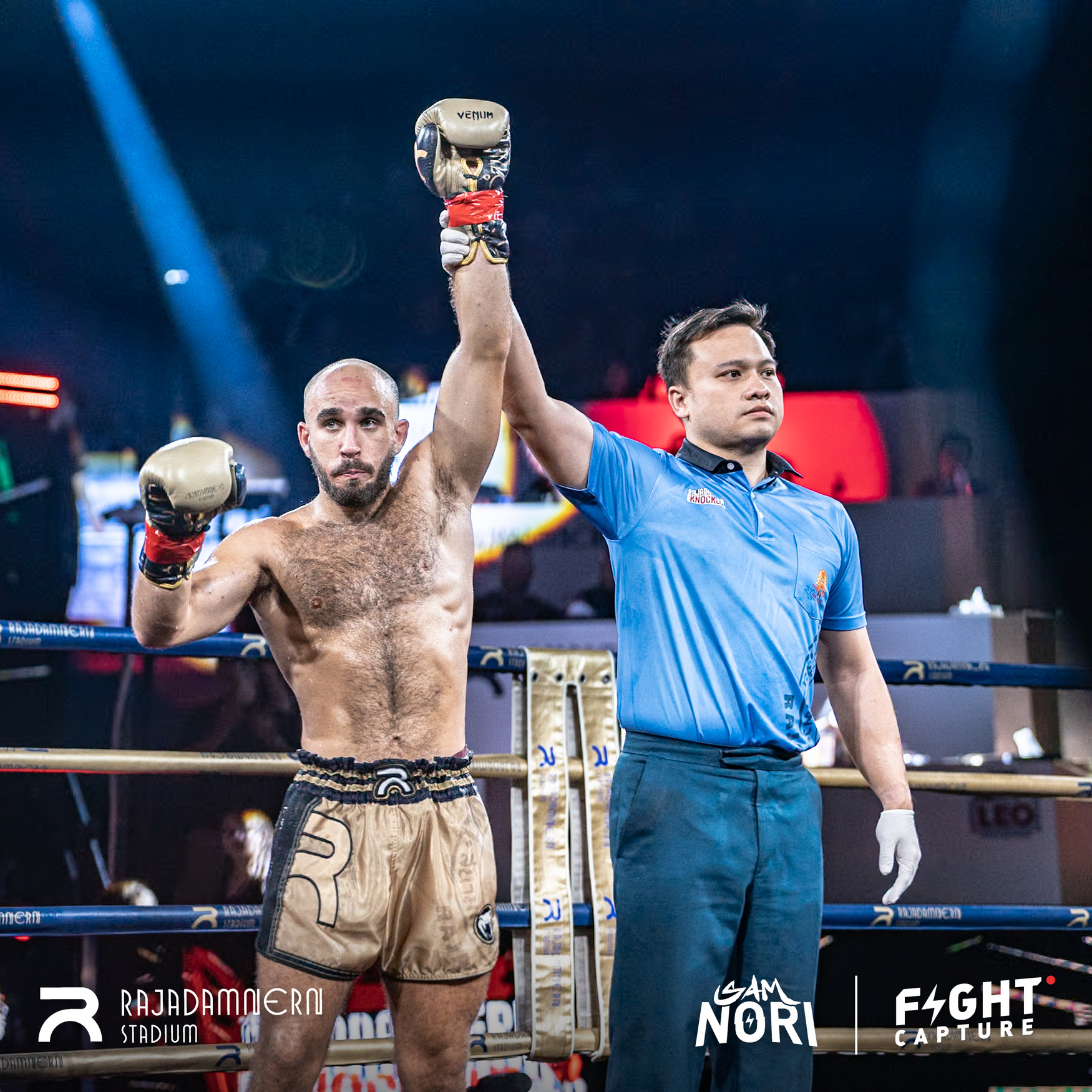 Devin Radianu has his hand raised after a win