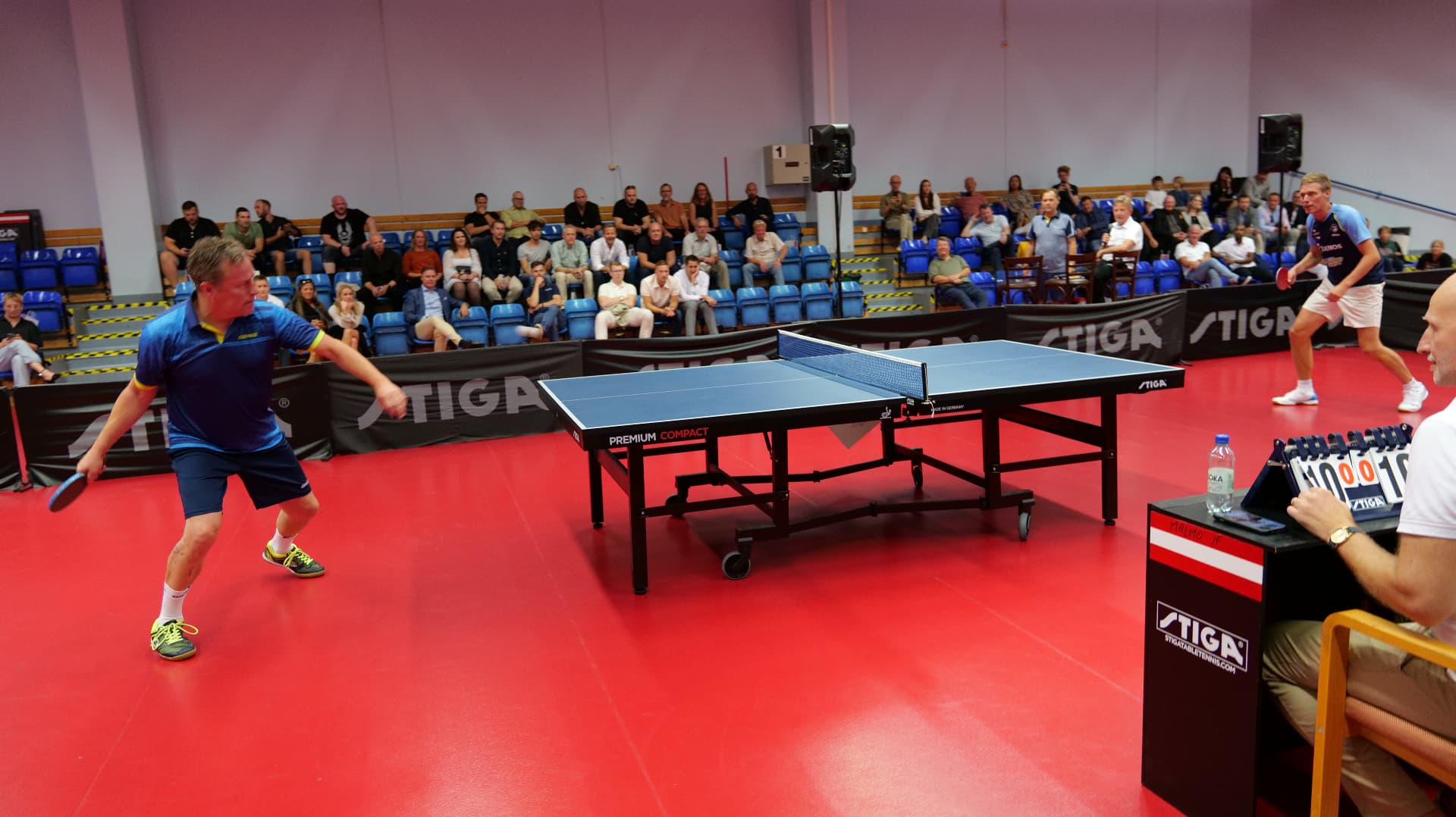 Two players in a duel at a STIGA table during the exhibition table tennis match at the World Champions' Dinner in Malmö